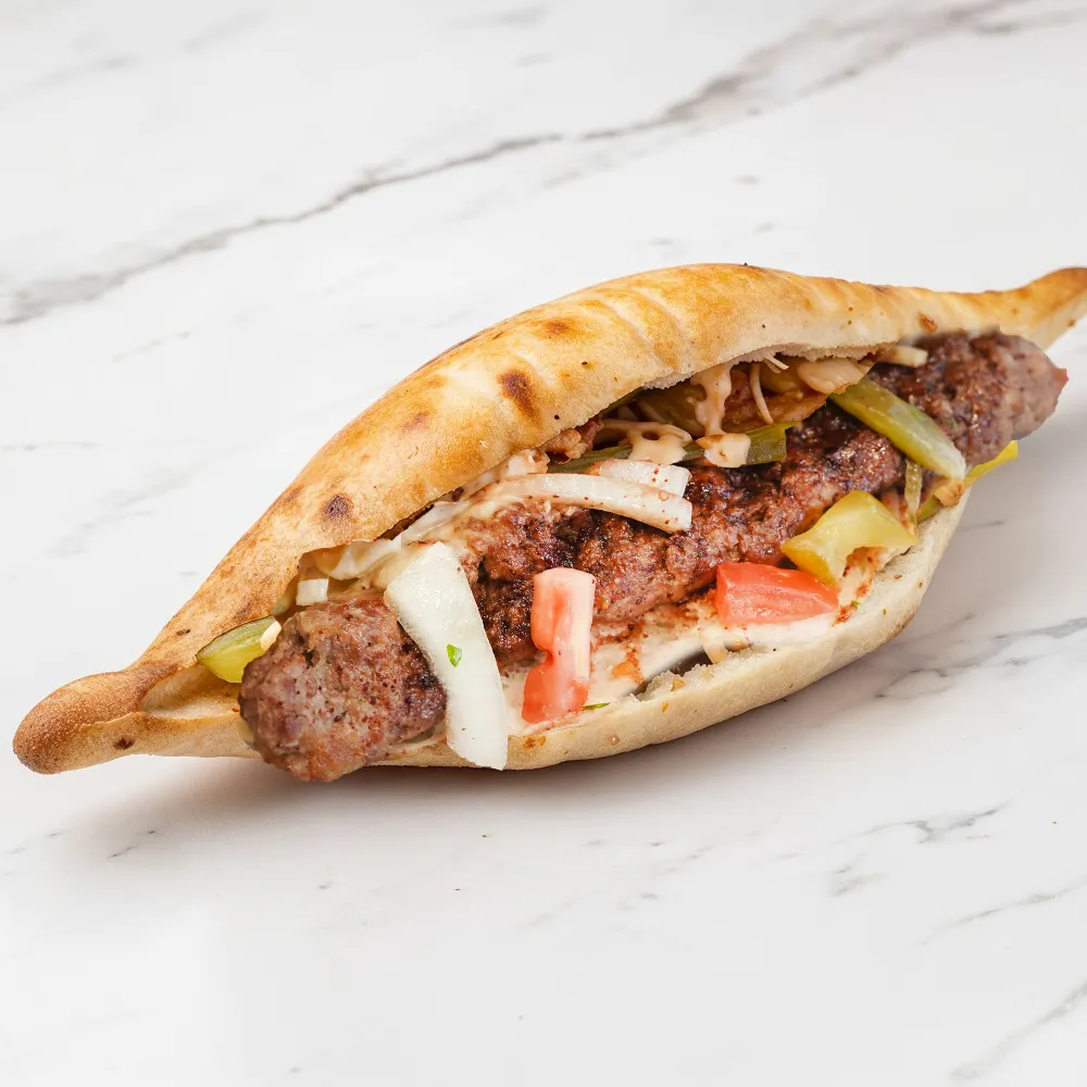 Kabab sandwich in diamond-shaped samoon bread