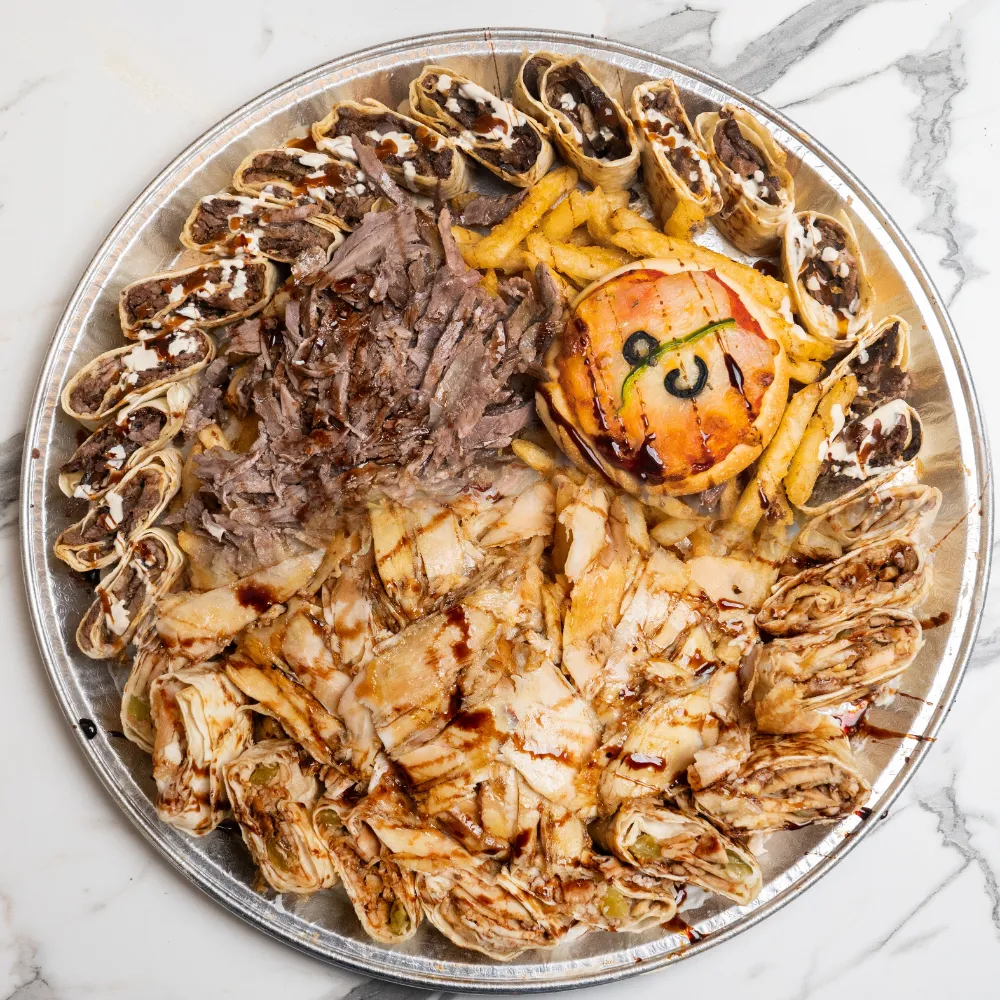 Mix shawarma Arabi tray: saj wraps cut Arabi style with fries and pickles